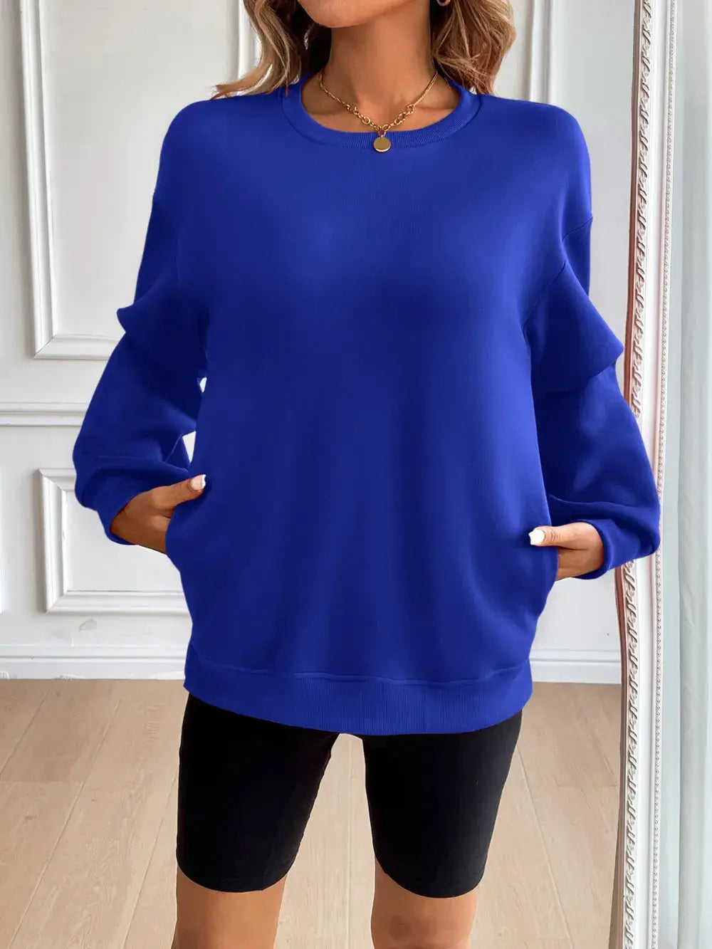 Ivy Lane blue round neck long sleeve sweatshirt with pockets, featuring a basic style and slightly stretchy fabric.
